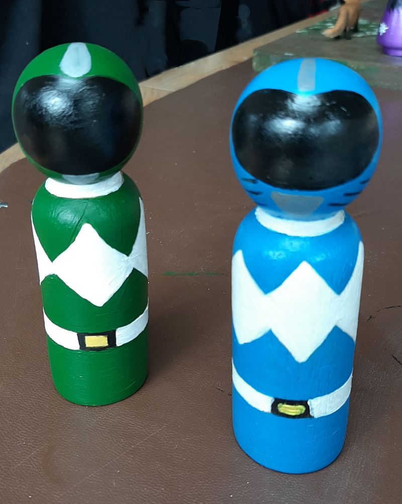 Green and Blue Peg dolls in helmets by DollyPegs